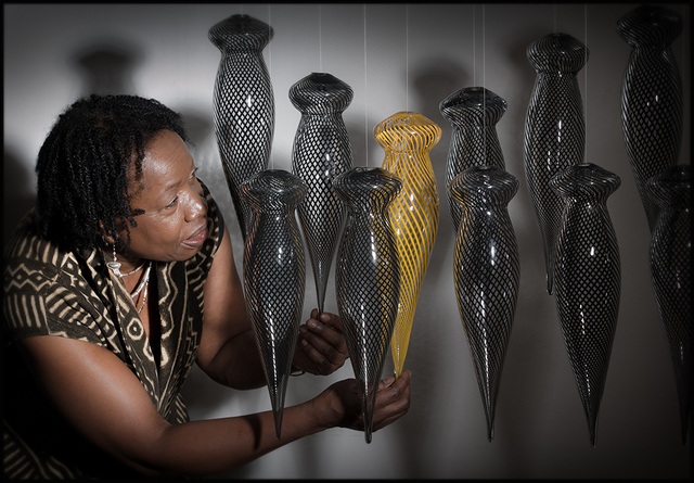 Magdalene Odundo with some of the units from the installation Transition II