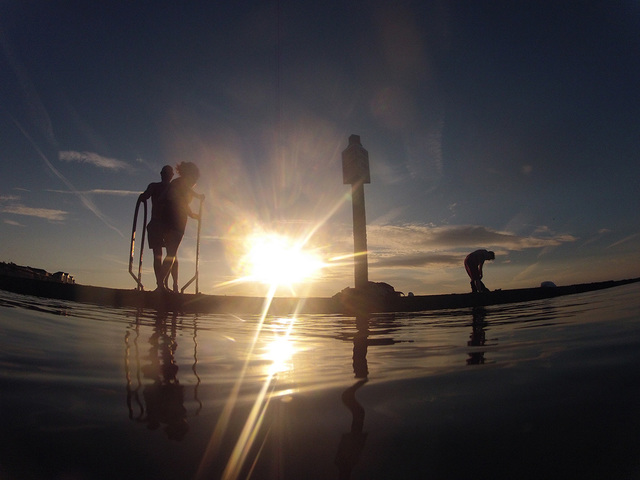 Walpole Bay pool - swimmers at sunset